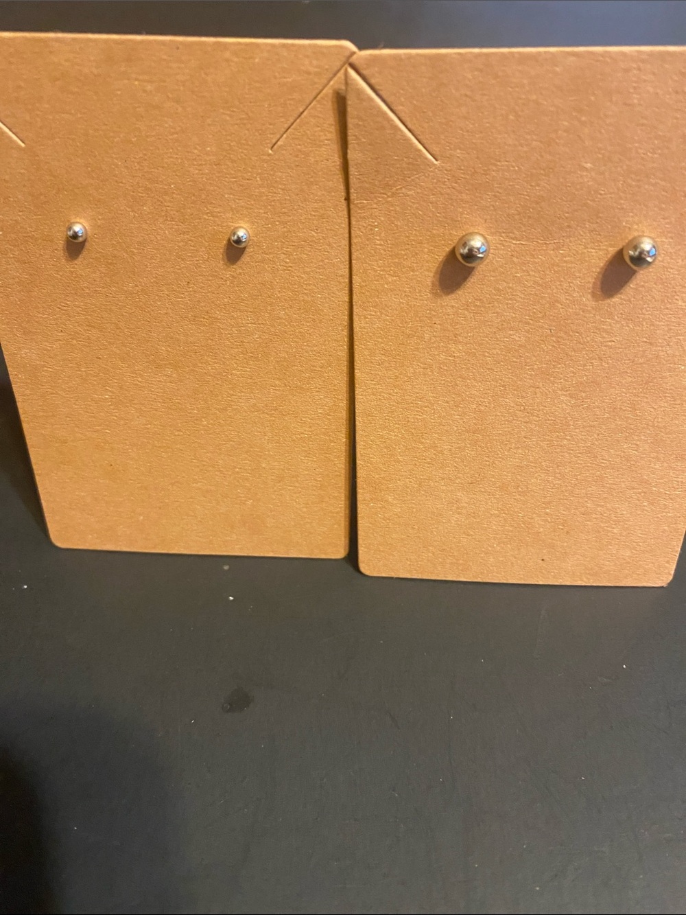 Simple Silver Ball Stud Earrings on Brown Card